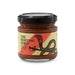 The Refined Graze: Christmas Edition - A jar of tomato relish featuring a black lid, with a design of a snake and a sword, in red and yellow tones.