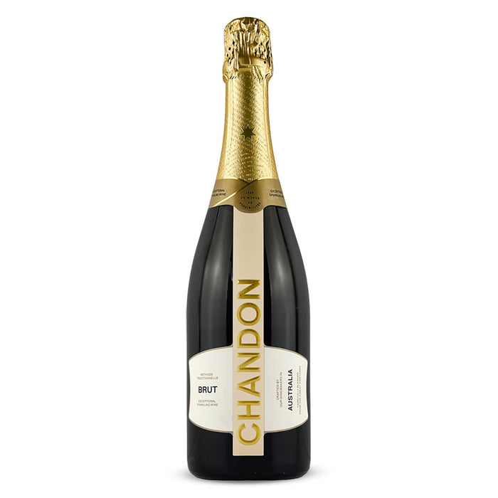 The Coastal Edit - A champagne bottle with a black body and a gold foil neck, featuring a prominent label with a logo.