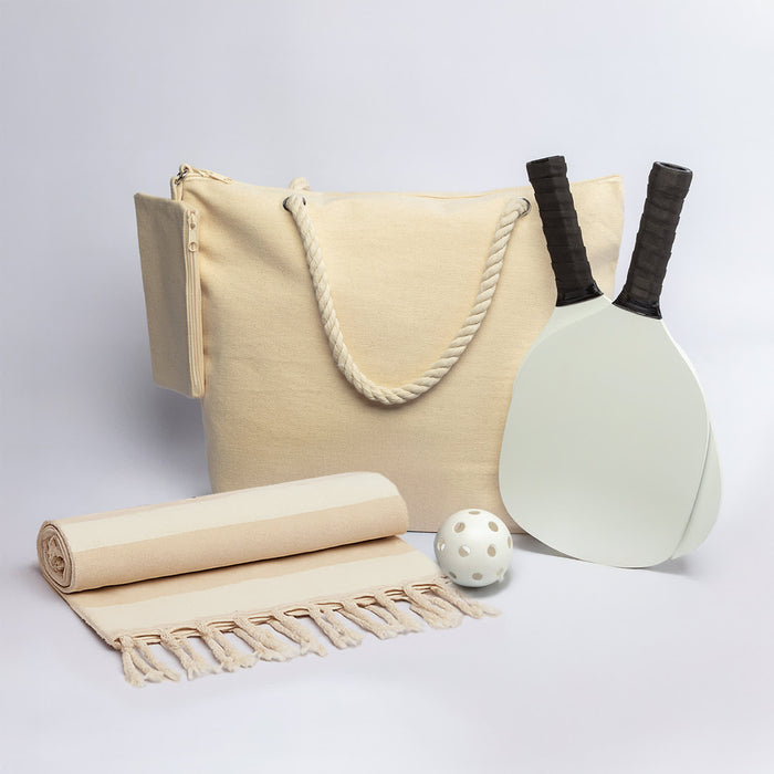 The Courtside Carry - A drink bottle, two paddles, a ball, a towel, and a cream tote bag, all featuring a simple design.