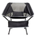 The Escape Pack - A black Marlin Folding Chair featuring a mesh back and a sturdy frame, with a pocket at the bottom.