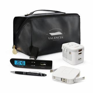 Tech Pack Travel - A black travel bag with a clock, pen, power adapter, and USB charger, featuring a logo on the bag.