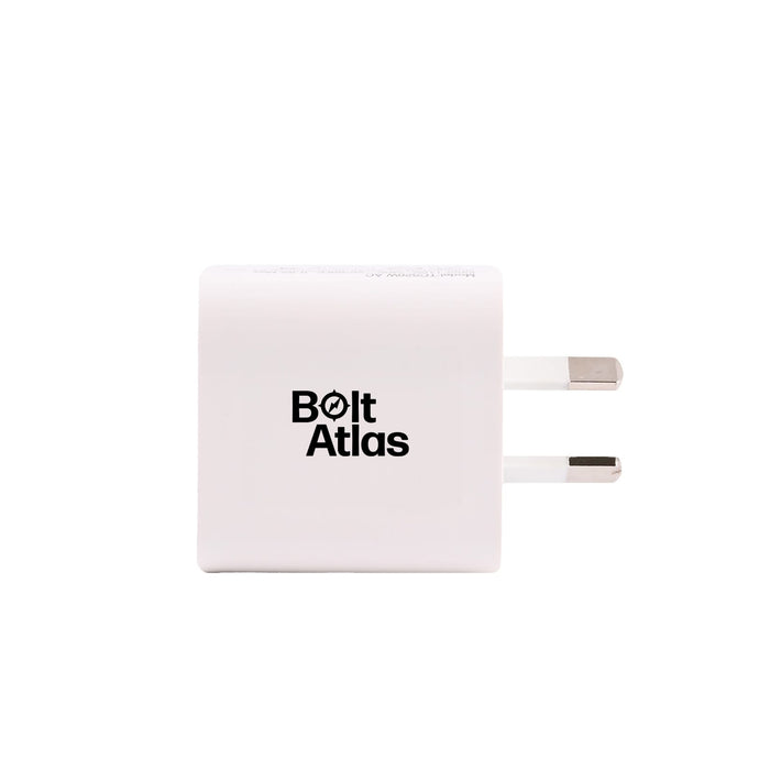 Tech Pack Power - A white power adapter with two prongs and a logo on the front.