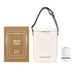 Pavilion Cooler by The Line Edit. - A cooler bag in off-white with a strap, next to a brown box featuring branding and an informational sheet.