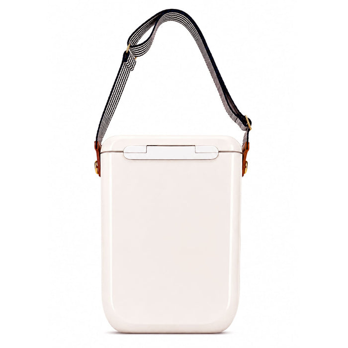 Pavilion Cooler by The Line Edit. - A cooler with a sleek cream exterior and a detachable striped strap. It features a sturdy handle for easy carrying.