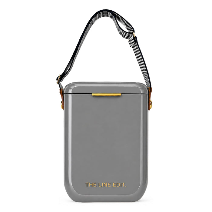 Pavilion Cooler by The Line Edit. - A grey cooler with a shoulder strap and a logo on the front, featuring a sleek, modern design.