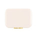 Pavilion Cooler by The Line Edit. - A rectangular cooler in a sleek cream colour with a gold clasp and a logo.