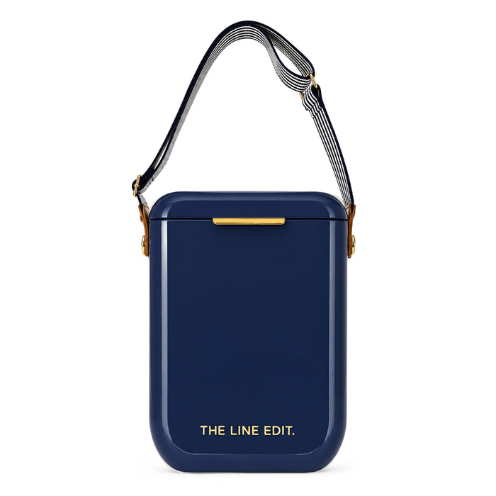 The Festive Edit Gift Set - A navy blue rectangular gift set with a detachable strap and a simple logo.