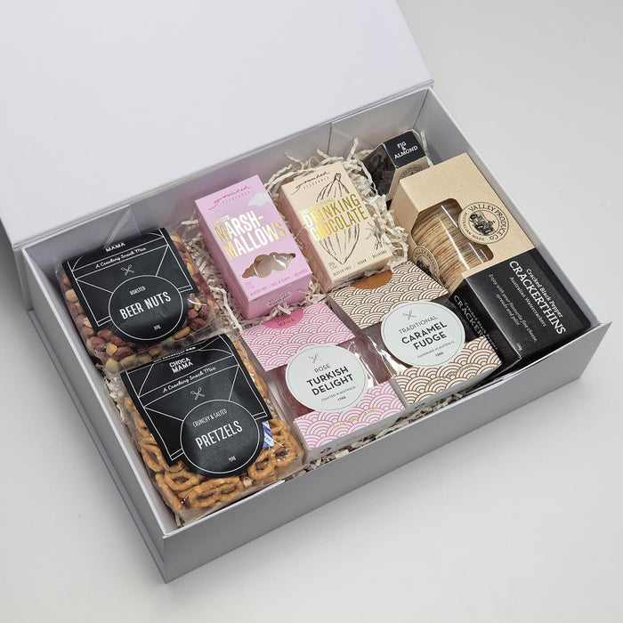The Big Indulge - A gift box featuring an assortment of sweets and snacks, including pretzels, marshmallows, Turkish delight, and fudge.
