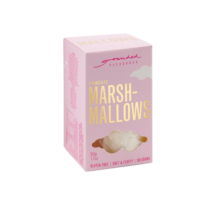 The Treat Kit - A pink box of gluten-free marshmallows with a soft and fluffy texture. It features a logo on the packaging.