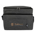 The Coastal Edit - A grey cooler bag with a zip closure and a front pocket, featuring a logo and branding.