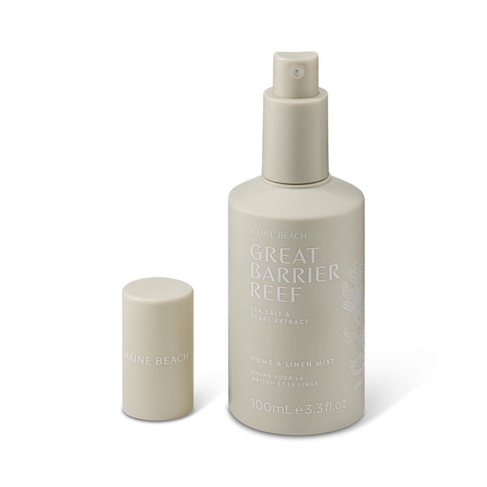 The Coastal Edit - A spray bottle of home and linen mist in a soft beige colour, featuring a cap and a logo.