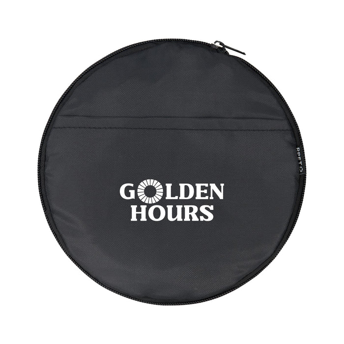 The Escape Pack - A round black zippered pouch with a logo and text on the front. The material appears durable and lightweight.