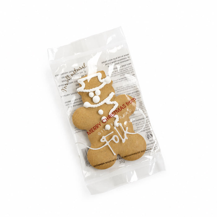 The Glow & Graze: Christmas Edition - A gingerbread man cookie in a clear wrapper, decorated with white icing for a festive look.
