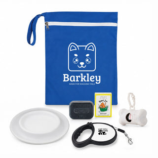 The Walkies Pack - A blue pouch contains a dog leash, bowl, soap, toy, and bone-shaped item, along with a logo.