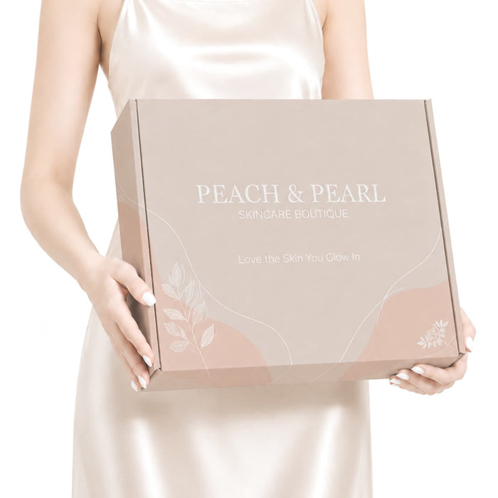 Custom Box with Locking Lid 360 x 305 x 105mm - A light beige box with a locking lid, featuring floral motifs and a logo, held by a person in a satin dress.