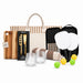 The Play & Graze - A picnic set featuring a striped tote bag, glasses, a cheese board, utensils, paddles, balls, and a blanket.
