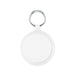 The Ultimate Welcome - Hot Chocolate Edition - A keyring with a round, white attachment featuring a textured rim, ideal for holding keys or small items.