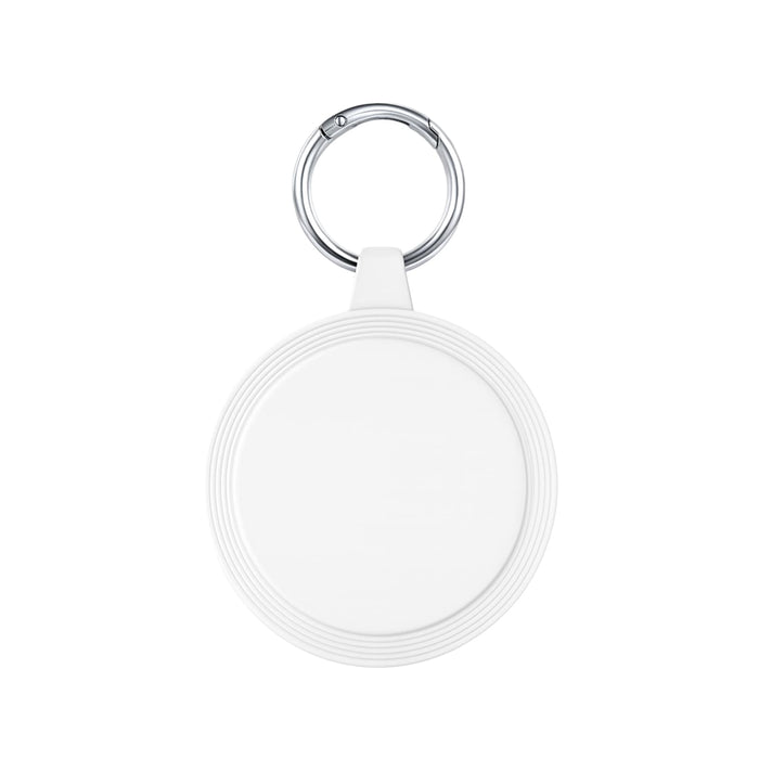 The Ultimate Welcome - Tea Edition - A keyring with a round, white attachment featuring a textured rim, ideal for holding keys or small items.