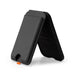 Cozy Phone Wallet - A black phone wallet with a stand feature, designed to hold a phone and cards. It has a small orange detail.