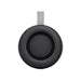 Delta 8W Speaker - A black portable speaker with a grey strap, featuring a circular design and textured surface.