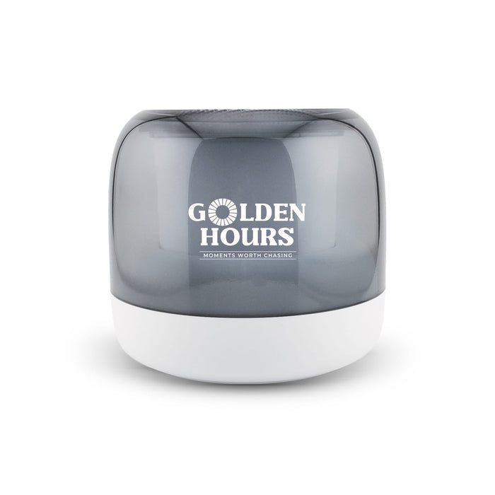 Dazzle RGB Speaker - A grey and white speaker with a rounded design and a logo on the front.