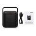 Hudson Bluetooth Speaker - A black Bluetooth speaker with a handle, accompanied by a USB cable and a user manual.