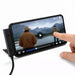Ultra Power Cable - A smartphone displaying a video of a person by a lake, resting on a stand with a charging cable attached.