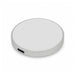 Puck Magnetic Phone and Watch Charger with Stand - A silver circular wireless charger with a USB-C port, featuring a smooth surface and simple design.