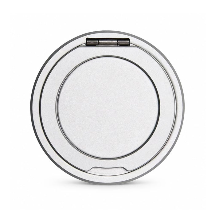 Puck Magnetic Phone and Watch Charger with Stand - A round, silver magnetic charger with a stand, featuring a smooth surface and a hinged element.