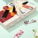 Fridge Magnet and Book Mark – Large - A collection of large bookmarks featuring various vibrant floral and festive designs, placed on a book.