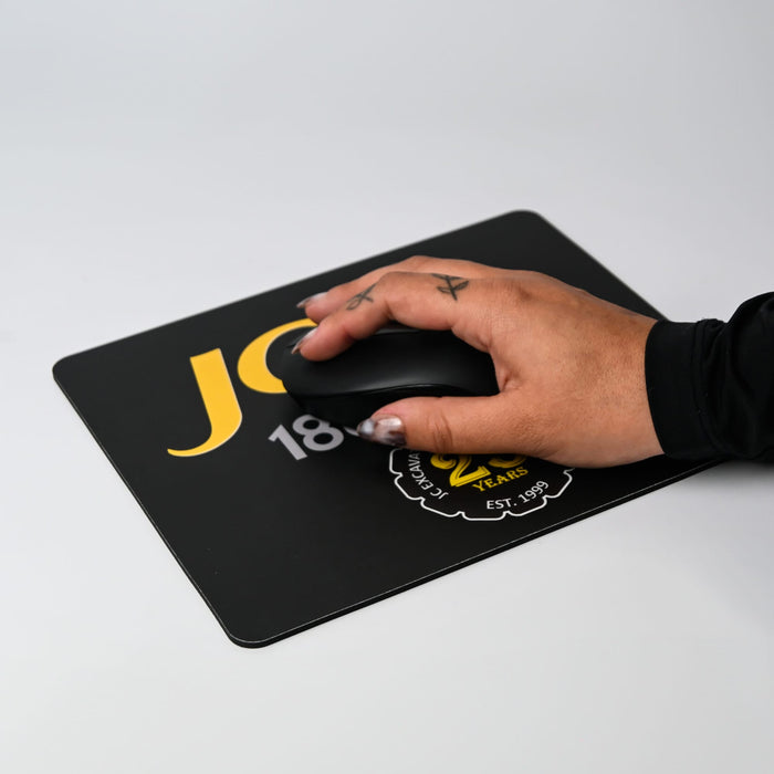 Fabric Mouse Mat (225mm x 185mm) - A black fabric mouse mat with a hand using a black mouse, featuring a logo and yellow text.