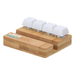 Bamboo Stand Keyboard Stress Reliever - A bamboo stand featuring four white keyboard key stress relievers with a logo on the side.