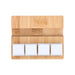 Bamboo Stand Keyboard Stress Reliever - A bamboo stand featuring three white square stress reliever blocks on a smooth surface.