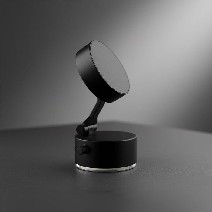 Ajustable Magnetic Mobile Stand - A black adjustable magnetic mobile stand with a round base and a swivelling top.