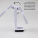 Traveler Mobile Phone Stand - A white dual-hinged mobile phone stand with a circular pad and a flat base, designed for stability.