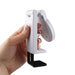 Traveler Mobile Phone Stand - A white mobile phone stand held in a hand, featuring a black base for stability.