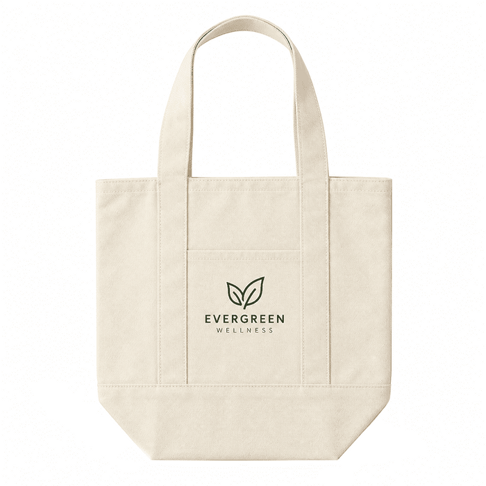 Mini Canvas Tote - A cream-coloured mini canvas tote with two handles and a front pocket. It features a logo on the front.