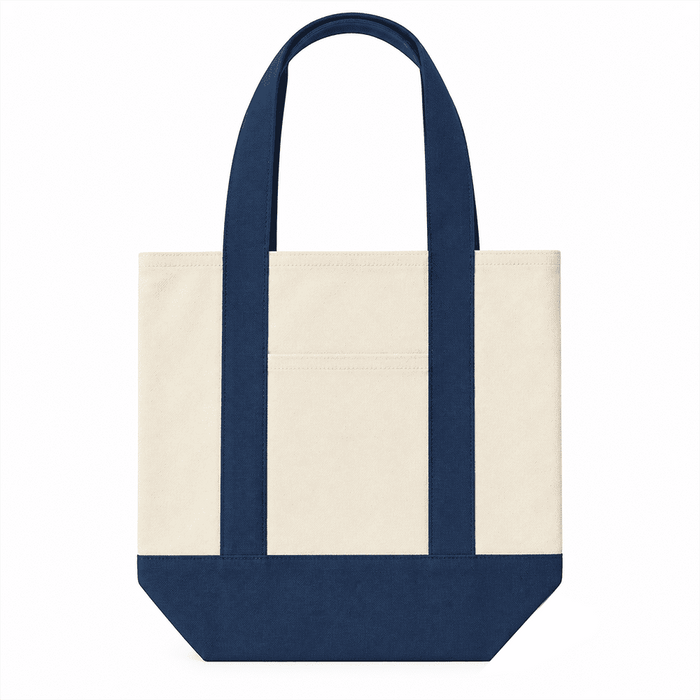 Mini Canvas Tote - A mini canvas tote in cream and navy blue, featuring two handles and a small pocket on the front.
