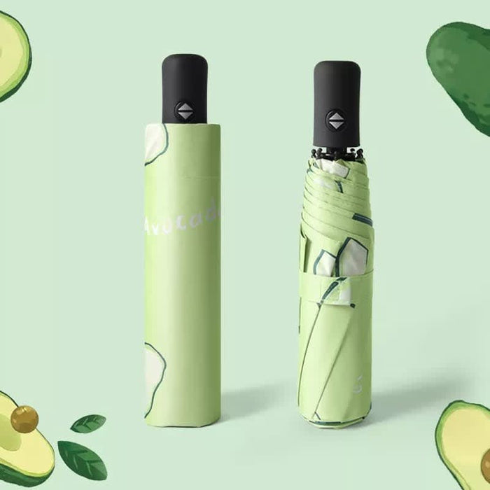 Full Colour Poppins Umbrella - A green umbrella with an avocado-themed design, featuring a black handle and a matching storage sleeve.