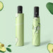 Full Colour Poppins Umbrella - A green umbrella with an avocado-themed design, featuring a black handle and a matching storage sleeve.