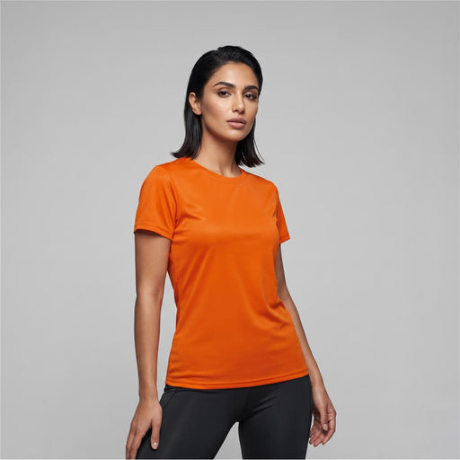 Women's Run Active Tee - An orange women's active tee with a fitted style, featuring short sleeves and a logo.