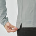 Women's Nevada L/S Micro Pique Polo - A light grey long sleeve polo shirt, featuring a side slit detail and a logo on the hem.