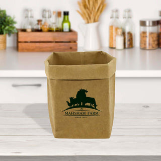 Sewo Kraft Paper Storage Bag – Large - A large kraft paper storage bag in brown, featuring a logo, placed on a kitchen countertop with various jars.