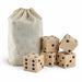 Wooden Yard Dice set - A set of wooden yard dice in a drawstring bag, featuring five light-coloured dice with black dots.