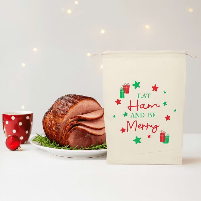 Christmas Ham Bag - A cream Christmas ham bag featuring festive graphics with green and red gifts and stars, and text in a playful font.