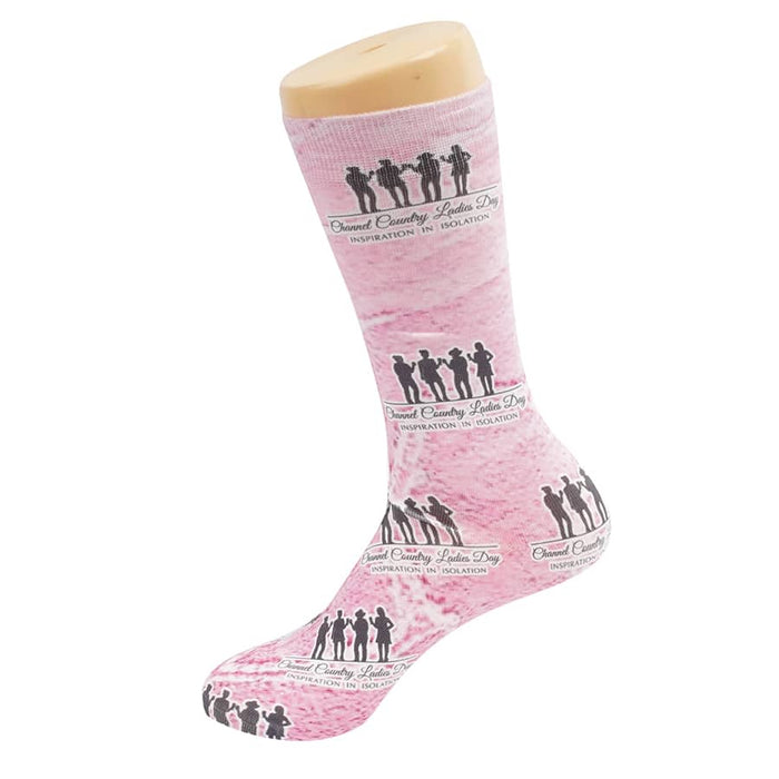 Magic Dress Socks - Pink dress sock featuring silhouetted figures and a logo, displayed on a sock mannequin.