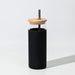 Sunrise Smoothie 500mL Tumbler - A drink bottle featuring a black exterior, a wooden lid, and a metal straw. It has a logo on it.