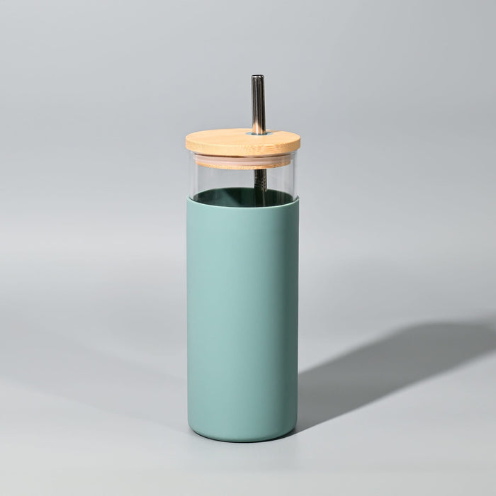 Sunrise Smoothie 500mL Tumbler - A drink bottle in a mint green silicone sleeve with a clear glass body and wooden lid featuring a straw.