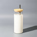 Sunrise Smoothie 500mL Tumbler - A drink bottle featuring a clear container with a white exterior and a wooden lid, complete with a metal straw.