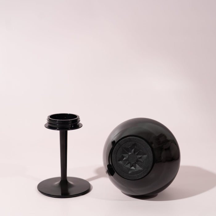 Shiraz Detachable Wine Glass - A black detachable wine glass with a round base and a separate stem, set against a light background.